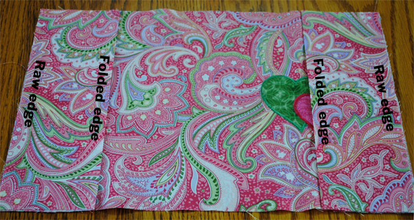 Embroidered notebook cover assembly.