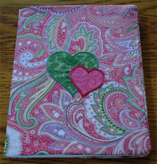 Finished embroidered notebook cover.